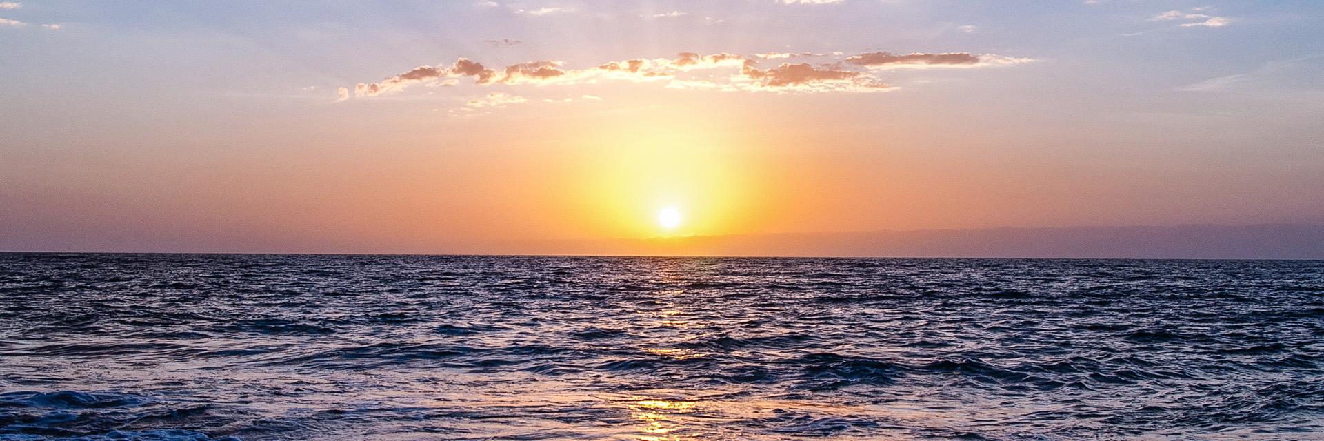 Sun setting on the ocean